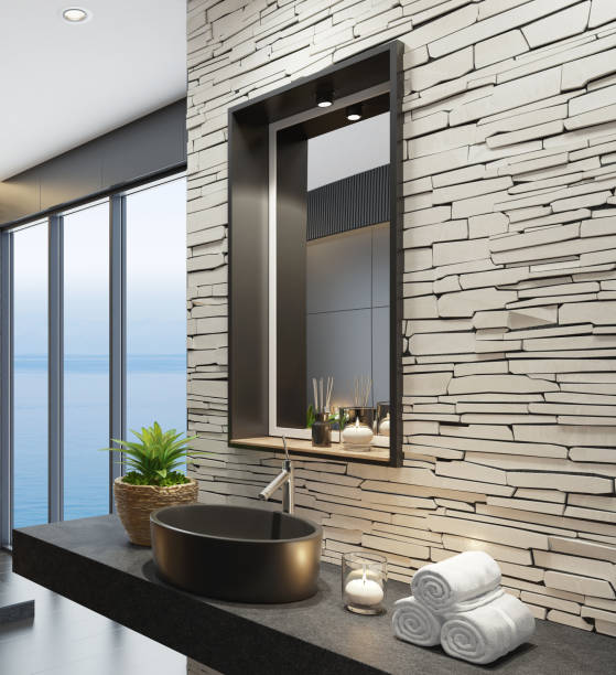 istock Luxurious modern home spa bathroom with matte white stacked stone wall and squared black matte mirror 1253545597