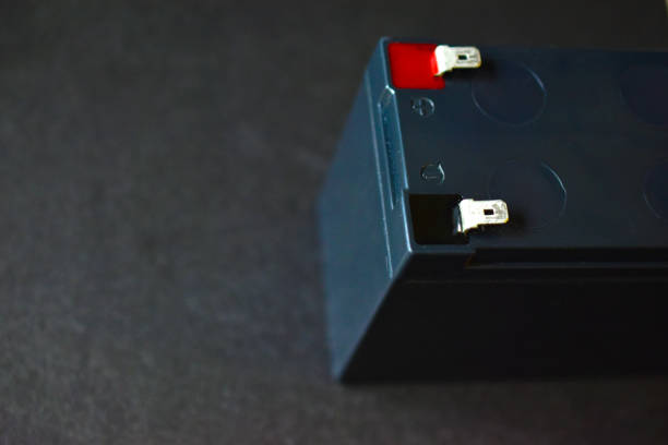 istock Lead battery from an uninterruptible power supply on a black background 1253546512