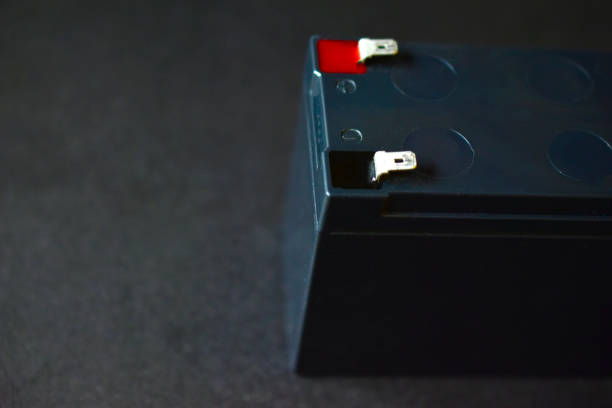 istock Lead battery from an uninterruptible power supply on a black background 1253546514