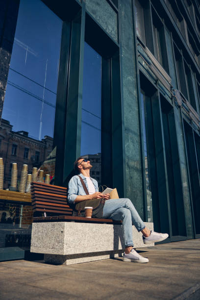 istock Relaxed young man catching lights of the sun 1253546789