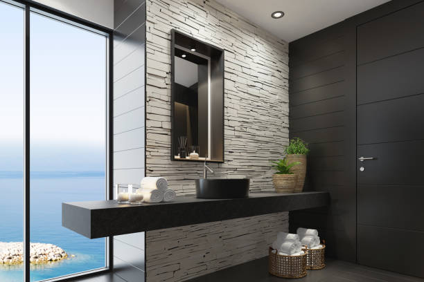 Luxurious modern home spa bathroom with matte white stacked stone wall and squared black matte mirror Trendy and modern home spa bathroom with matte black tiles, white stacked stone wall and lots of natural light. Cozy interior. Modern black bath tub and sink. Black and white concept. Candles light. Big panoramic windows. Black stone floor. 3d rendering.
+++background is my photo med spa stock pictures, royalty-free photos & images