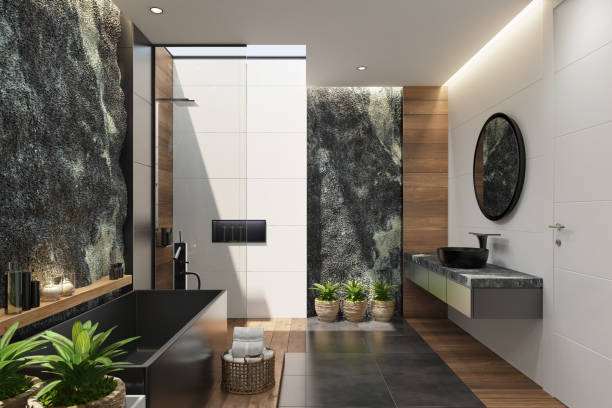 istock Spa bathroom in luxurious modern villa with huge natural rock wall 1253547527
