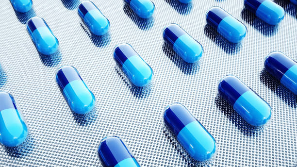 istock tablets and pills packed. Medical concept, background. 3d rendering. 1253550945