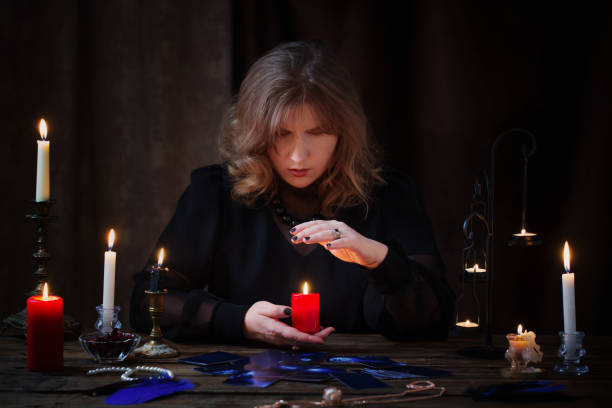 istock mature witch  conjures on  dark background 1253559138