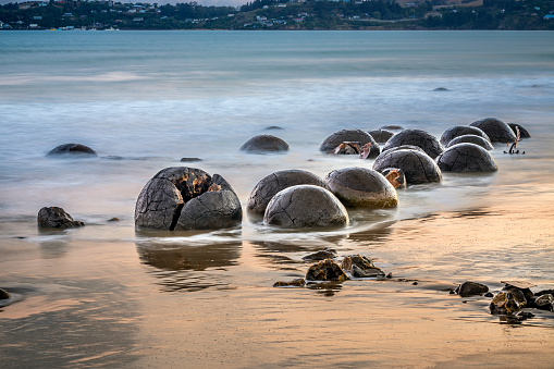 Round Moeraki Boulders at sunset, Koekohe beach, Otago, South Island, New Zealand.