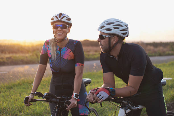 istock Man and woman riding a bicycle 1253564579