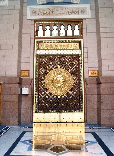 Entrance door (King Abdul Azeez Gate) to the Prophet Muhammad Mosque MADINAH, SAUDI ARABIA - FEBRUARY 5,2017 : View of entrance door (King Abdul Azeez Gate) to the Prophet Muhammad Mosque or An- Nabawi mosque in Madinah, is second holiest site in Islam. al masjid an nabawi stock pictures, royalty-free photos & images
