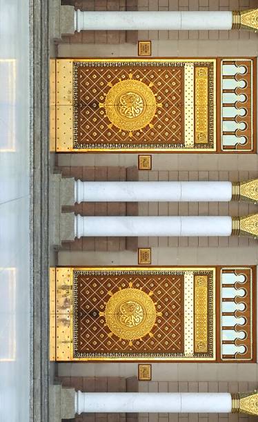 Entrance door (Al- Saud Gate) to the Prophet Muhammad Mosque MADINAH, SAUDI ARABIA - FEBRUARY 8,2017 : View of entrance door (Al- Saud Gate) to the Prophet Muhammad Mosque or An- Nabawi mosque in Madinah, is second holiest site in Islam al masjid an nabawi stock pictures, royalty-free photos & images