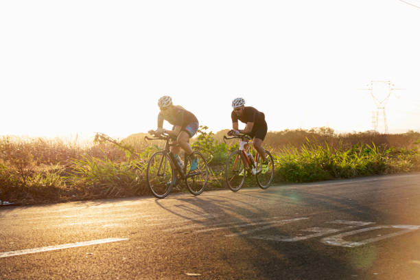 istock Man and woman riding a bicycle 1253564630