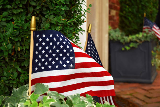 istock American flags displayed outside a home 1253574529