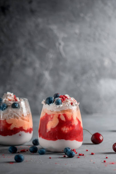 istock Close up of layered dessert with soft fruit and berries 1253582129