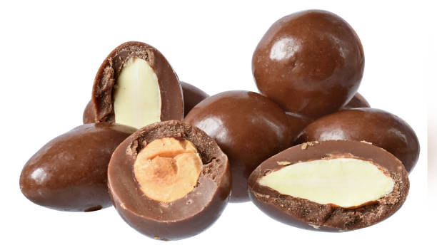 istock Chocolate balls with filling whole nuts isolated 1253583705
