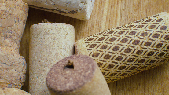 Extreme close up corks from bottles of wine. Top view wine corks on a wooden background. Macro shooting
