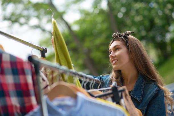 istock Beautiful young woman looking for vintage clothes 1253585281