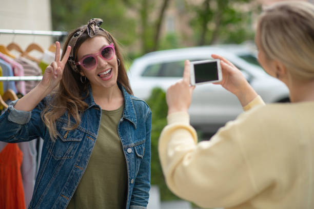 istock Joyful happy woman showing a V sign 1253585352