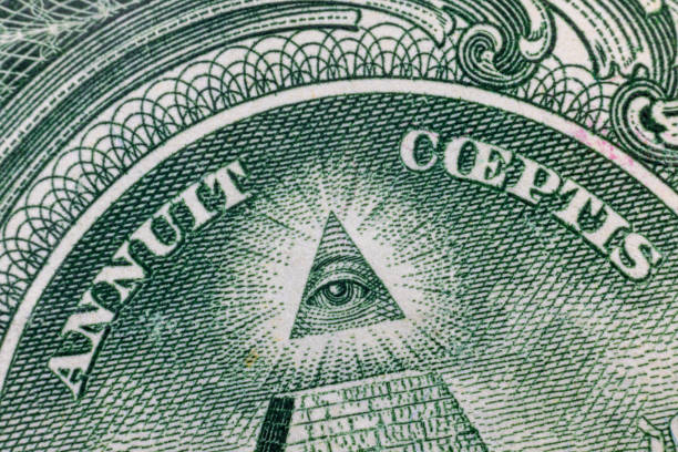 istock All-seeing eye on US one dollar bill closeup macro with soft focus on a pyramid. 1253586892