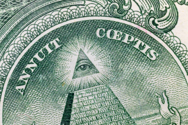 istock All-seeing eye on US one dollar bill closeup macro with soft focus on a pyramid. 1253586897