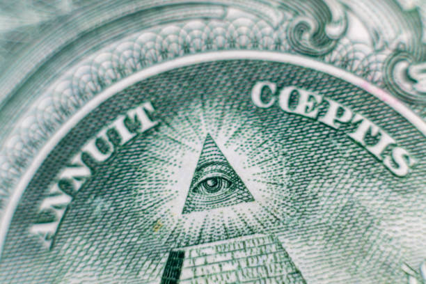 istock All-seeing eye on US one dollar bill closeup macro with soft focus on a pyramid. 1253586903