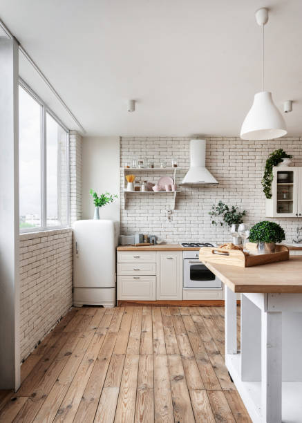 istock Kitchen at modern house with white interior design 1253592250