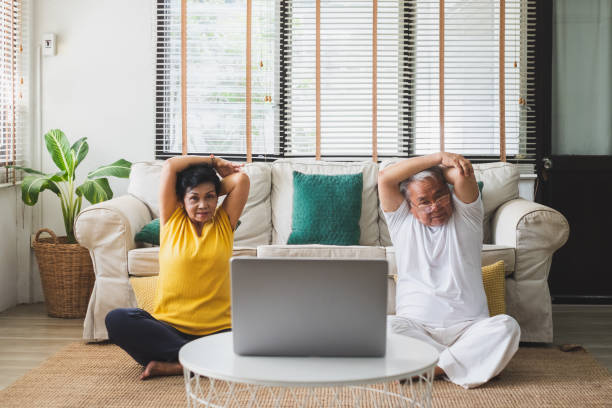 istock Asian old senior workout exercise and doing yoga at home 1253597174