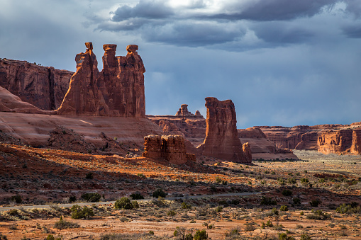 Beautiful view of Three Gossips (left) and Sheep Rock (right) sandstone rock structures seen along Arches Scenic Drive, Arches National Park, Moab, Utah