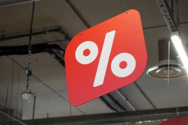 A red sign hangs on the ceiling of the store. stock photo