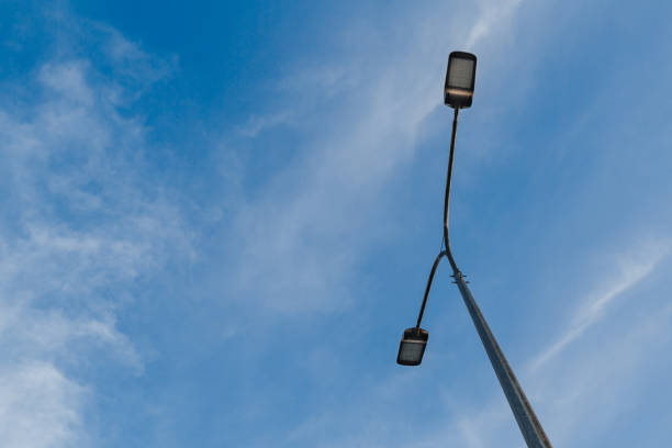 istock Street lantern on sky background.A modern street LED lighting pole 1253598875