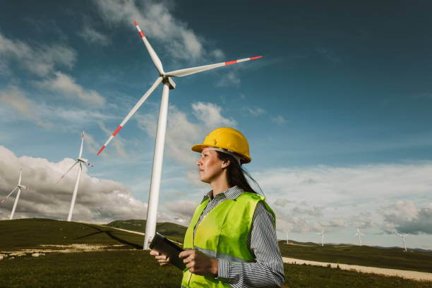 istock Windmill engineers inspection and progress check wind turbine 1253602258