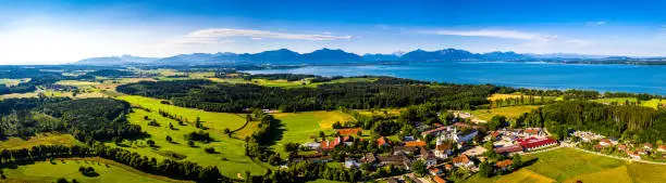 Chiemsee Lake Bavaria. Ising. Aerial Panorama Shot of Lake in Summer. Horse Stable. Agriculture Fields. Alps
