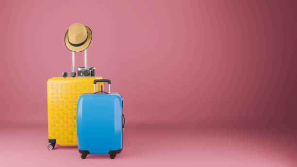 istock Yellow and blue suitcase with sun hat and glasses 1253604173