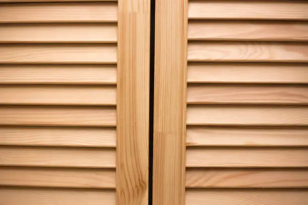 Wooden blinds panel. Vintage timber doors. Vintage home design.