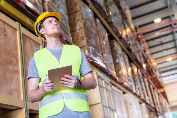 istock Portrait white caucasian worker with tablet in distribution warehouse 1253605754