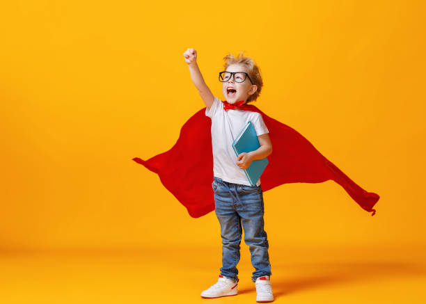 Little superhero studying at school