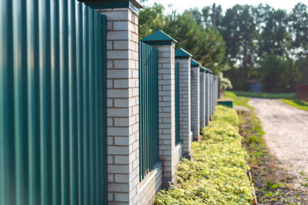 istock solid brick fence of a private house 1253606655