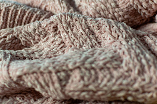 istock Fine textured and voluminous fabric in pink. Embossed textile pattern, pleasant to the touch and delicate, velvety 1253607768