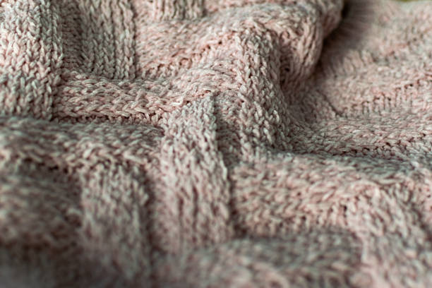 istock Fine textured and voluminous fabric in pink. Embossed textile pattern, pleasant to the touch and delicate, velvety 1253607823