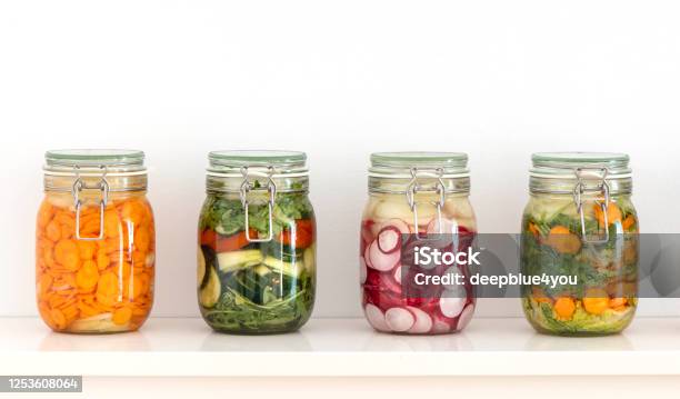 Various Fermented Vegetables In Mason Jars On The Kitchen Shelf Stock Photo - Download Image Now