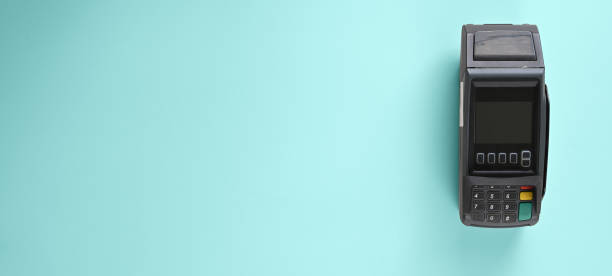 istock Payment terminal is putting on a colorful table. 1253608906