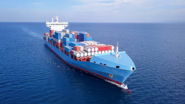 istock ULCV container ship sails on open water fully loaded with containers and cargo. 1253609106