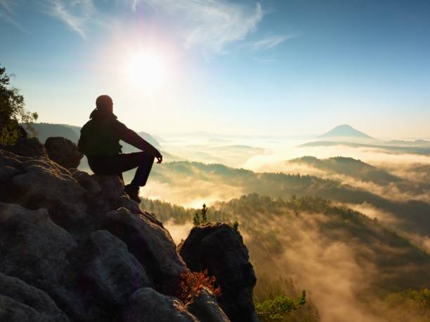 istock Hiker Man Take A Rest On Mountain Peak. Man Lay On Summit, Bellow Autumn Valley. 1253610148