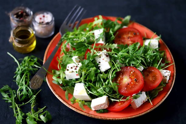 istock Tomato arugula feta salad. 1253610407