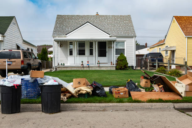 An evicted house at a suburban street with left belongings on the lawns near the 8 mile road, in the city of Detroit. Detroit, Michigan, USA - August 20, 2014: An evicted house at a suburban street with left belongings on the lawns near the 8 mile road, in the city of Detroit. eviction photos stock pictures, royalty-free photos & images