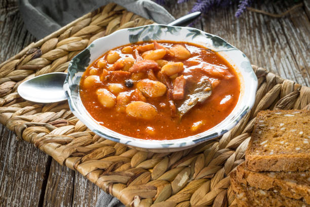 istock Beans with tomato sauce, bacon and sausage. 1253612851