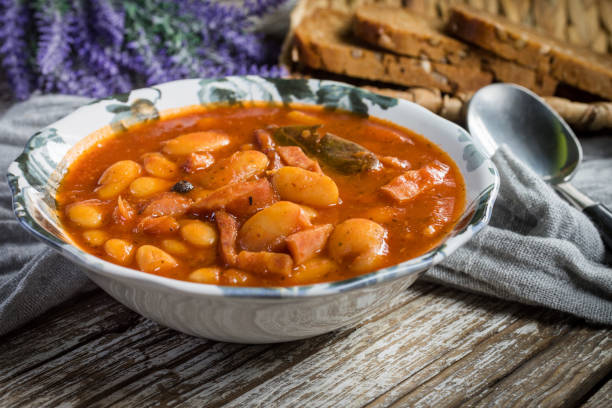 istock Beans with tomato sauce, bacon and sausage. 1253612894