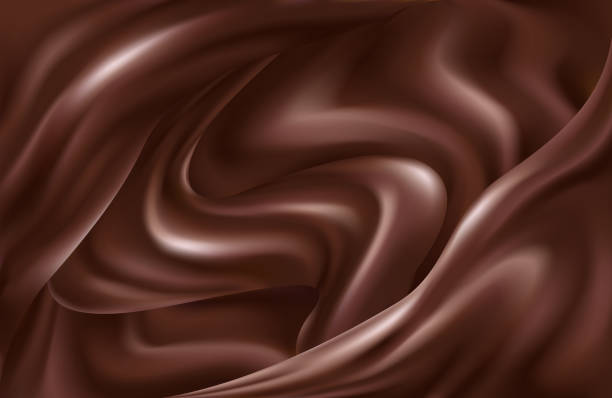 istock Dark brown background of swirling waves of liquid chocolate 1253615844