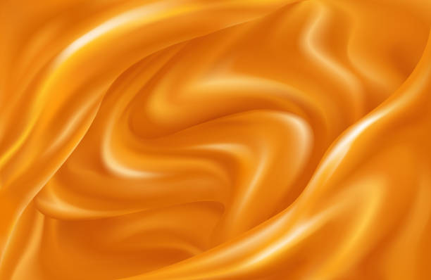 istock Bright background of swirling waves of orange juice 1253616069