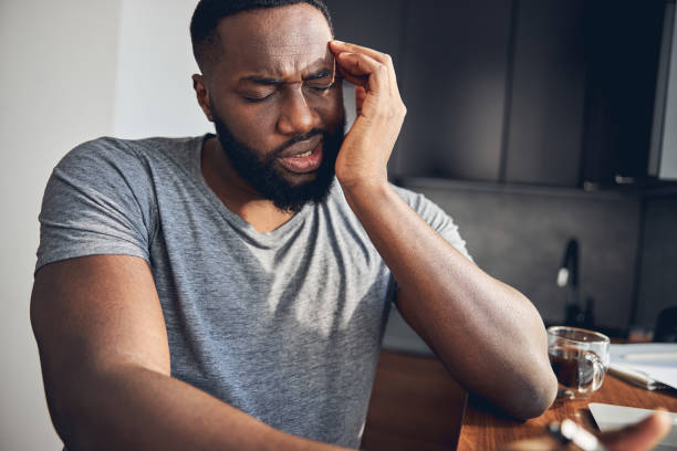 istock Emotional young man making face from sharp pain 1253616506