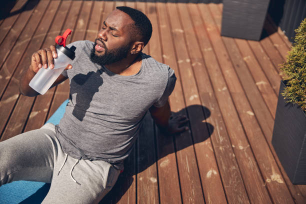 istock Tired bearded male person having rest after training 1253616654