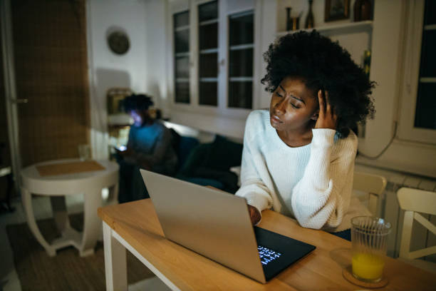 istock Woman works from home late at night 1253617304