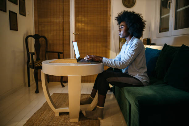 istock Young woman surfing the net at home 1253617337
